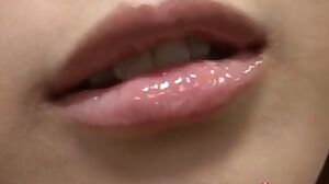 Naked Japanese teen rubbing her soapy pussy